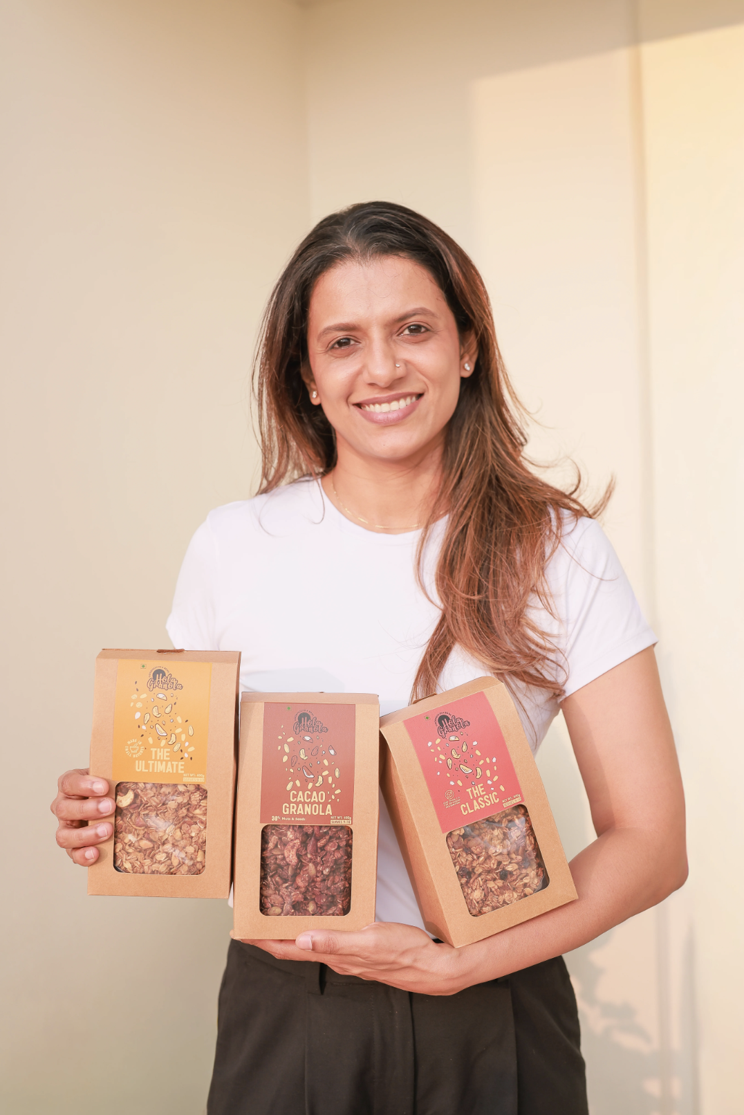 Tracy Thomas holding Hola Granola handcrafted organic granola